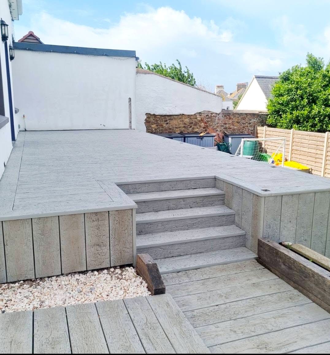 Composite decking with steps and planter, St Brelade