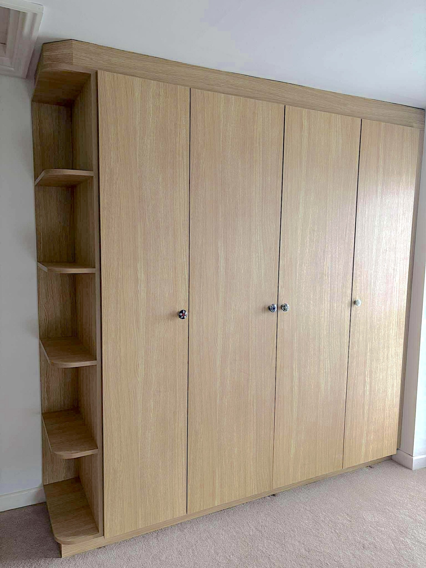 Fitted oak wardrobes with corner shelving, Jersey